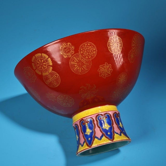 This is a finely painted antique porcelain stem bowl, featuring vibrant enamel decoration in the famille rose style. The...