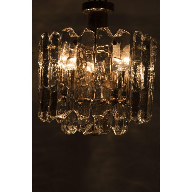 Wonderful 'palazzo' hanging lamp designed by j.t. Kalmar in the 1960s. The lamp is made of beautifully shaped glass...