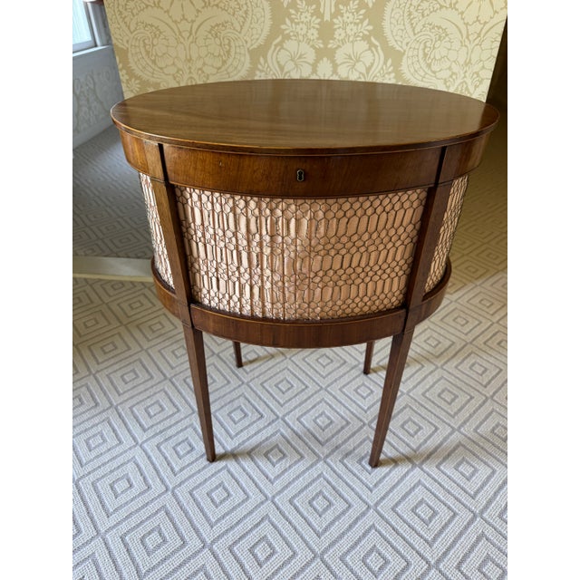 This is a beautiful sewing box from the Sheraton period. In beautiful mahogany it is on delicate legs and has satinwood...