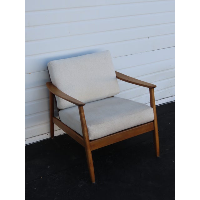 This Side Chair is made out of wood, solid wood, caning, and upholstery. This Chair has Mid Century Modern style and...