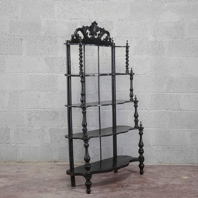 This open-shelf bookcase is an elegant example of period furniture dating back to the 19th century. The piece stands out...