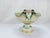 A Meissen porcelain centerpiece of oval openwork construction, two floral windows oppose each of the main bodies of the...