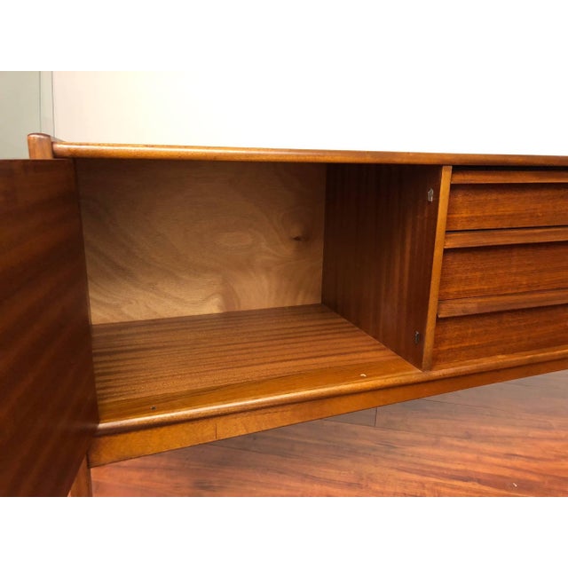 Younger ‘Da Silva’ model vintage teak sideboard designed by John Herbert and featured in the Younger 1964 catalog. This...
