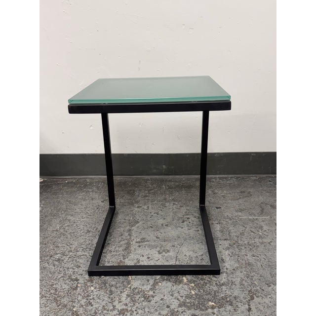 Design Plus Gallery presents the Parsons C-Shape Table from Room & Board. A square seafoam glass top with beveled edges...