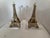 Pair of lucite and resin gold Eiffel Tower motif bookends. No maker’s marks. Each bookend measures 6” W x 4” D x 7” H.