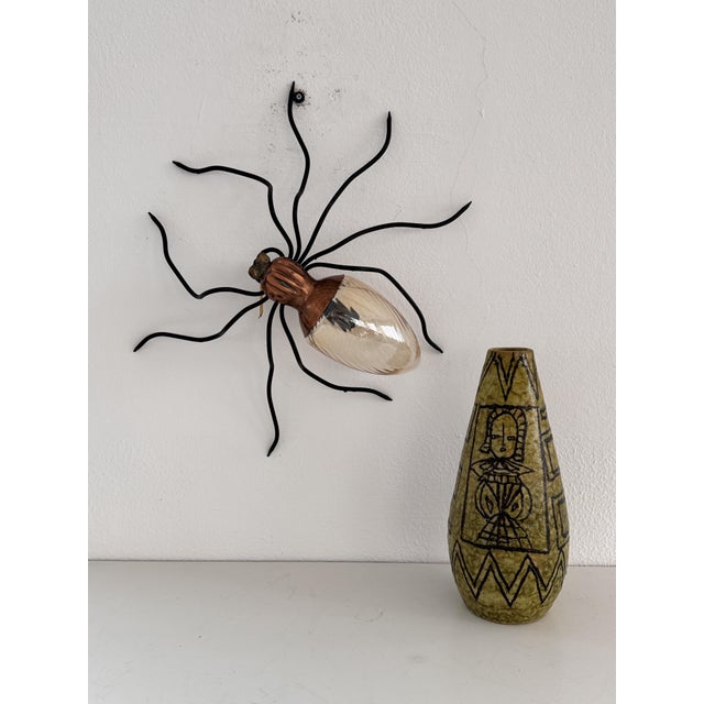 Gorgeous spider lamp with nine legs, made in italy, circa 1960s. this lamp is a typical outdoor lamp mounted over the...