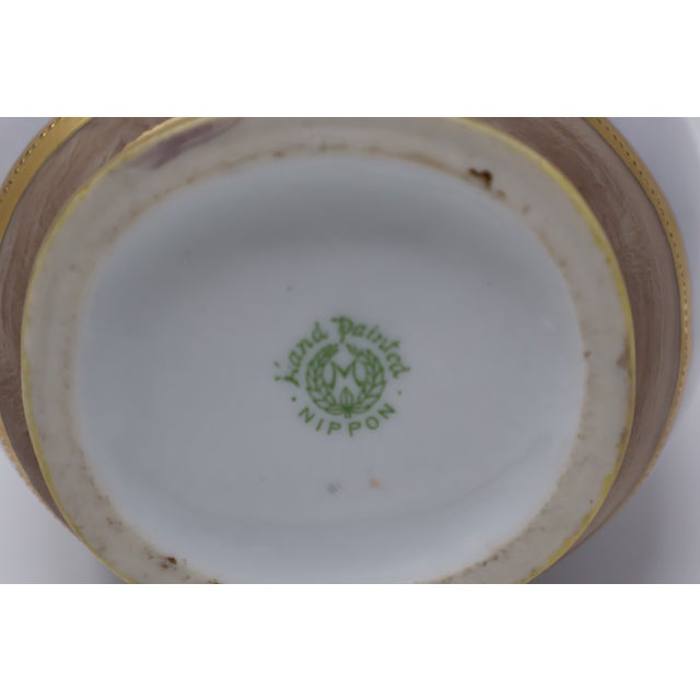 An intricately decorated antique Japanese porcelain vase attributed to Morimura Brothers, associated with early Noritake,...