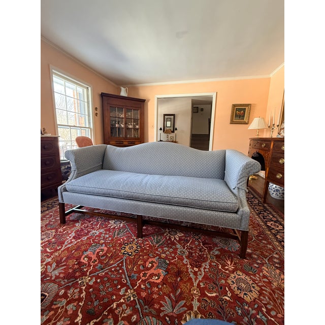 Hickory Chair Sheraton Sofa A bench seat with flared arms and shaped back on square legs connected by a stretcher....