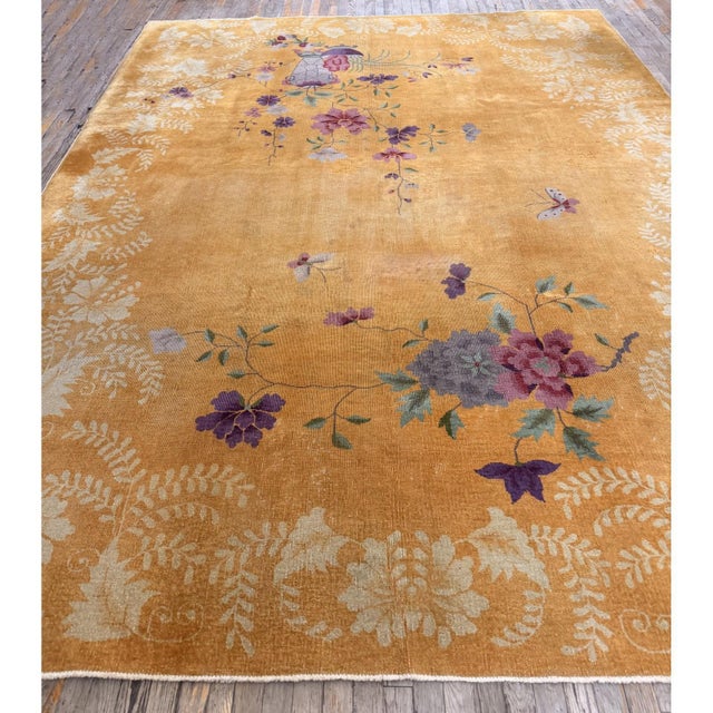 This is an antique Chinese Art Deco rug from circa 1920. It belongs to a category of pieces woven between the world wars...