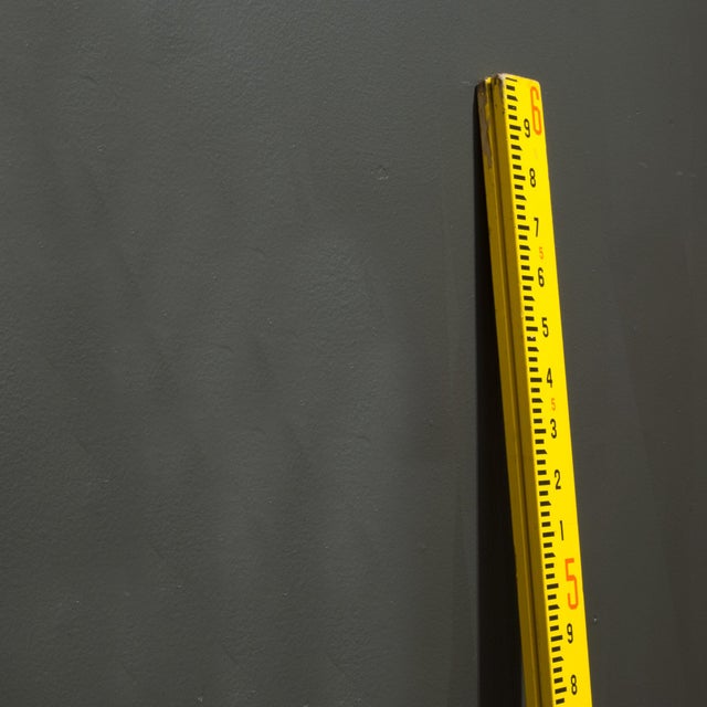 ABOUT Original yellow 72" surveyor's pole and one logging measuring stick. The logging measuring stick is numbered on 4...