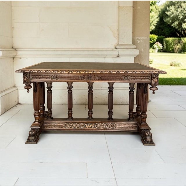 A rare French Renaissance Revival partner's desk in walnut, magnificently hand carved with angels at all four corners and...