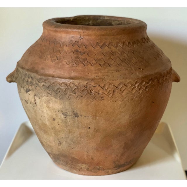 About Old tinaja of Calanda (Teruel), Spain. Made of red clay with handcrafted circular figures and two handles. A...