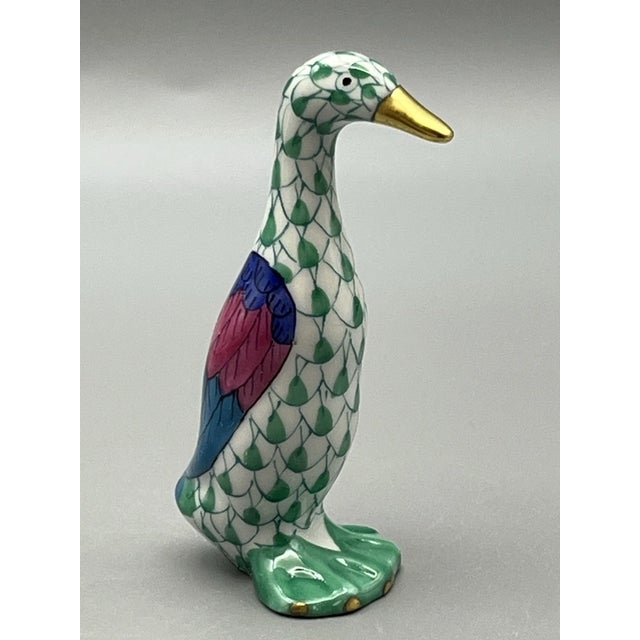 Crafted in Hungary, this charming little goose features intricate scale-like painting, accented with rich hand-applied...