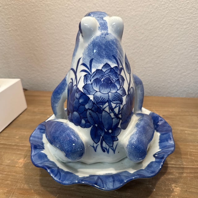 A lucky charm frog. Beautiful garden figure in blue and white. 9” x 8.5” tall