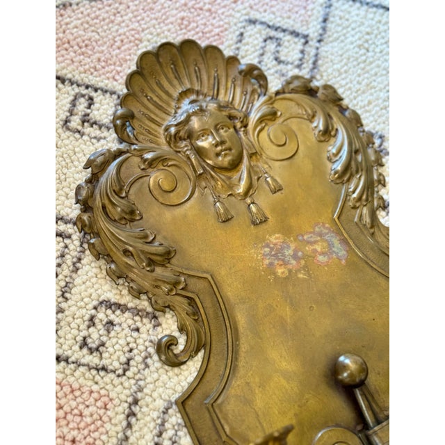 Beautiful Antique brass wall sconce. This has two candle holders. It is large and can easily fill your space. It does have...