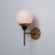 Italian wall sconce dating from the 1950s, characterized by a refined geometric composition and a balanced combination of...