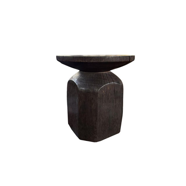 Crafted from solid suar wood and meticulously hand-finished by skilled artisans in Bali, this sculptural side table...