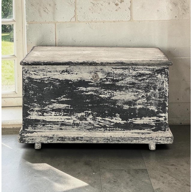 Early 19th century rustic Swedish painted trunk or blanket chest is a remarkable example of the enduring craftsmanship and...