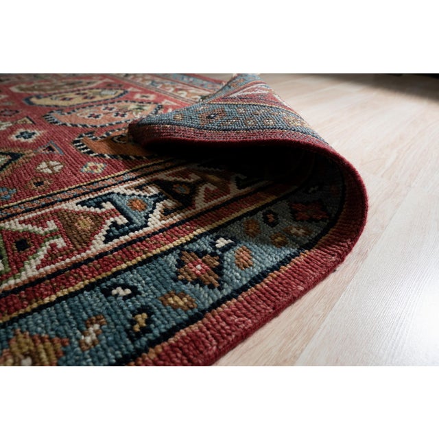 Kira Traditional Coral Hand Knotted Wool Rug, Country of Origin: India. This exquisite piece showcases the enduring...