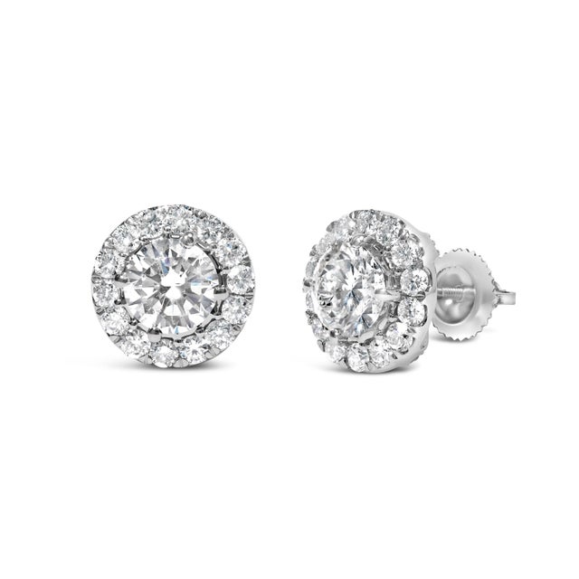 Unveil a world of luminous brilliance with these exquisite 14K white gold earrings plated with protective rhodium,...