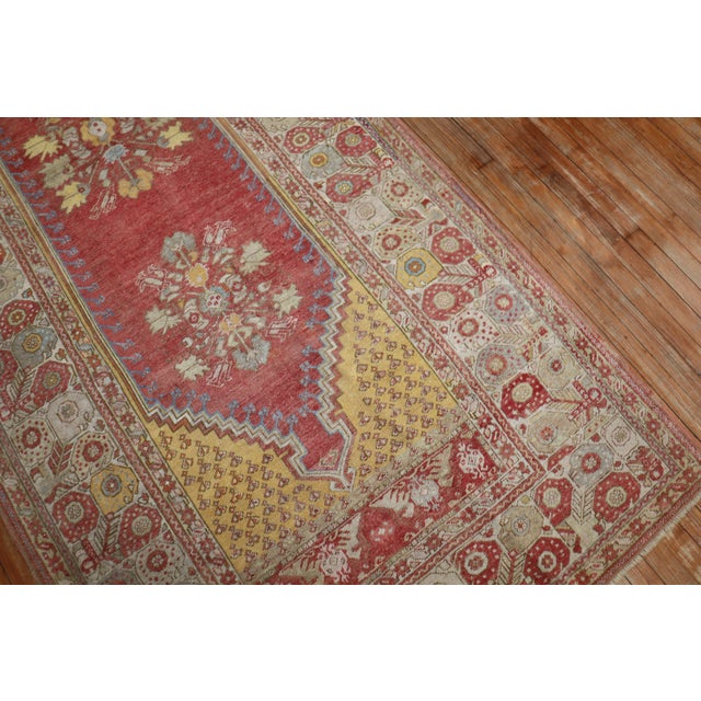 A fine quality Early 20th-century wide Turkish runner with a floral motif in warm colors Measures: 4'5” x 10'10”.