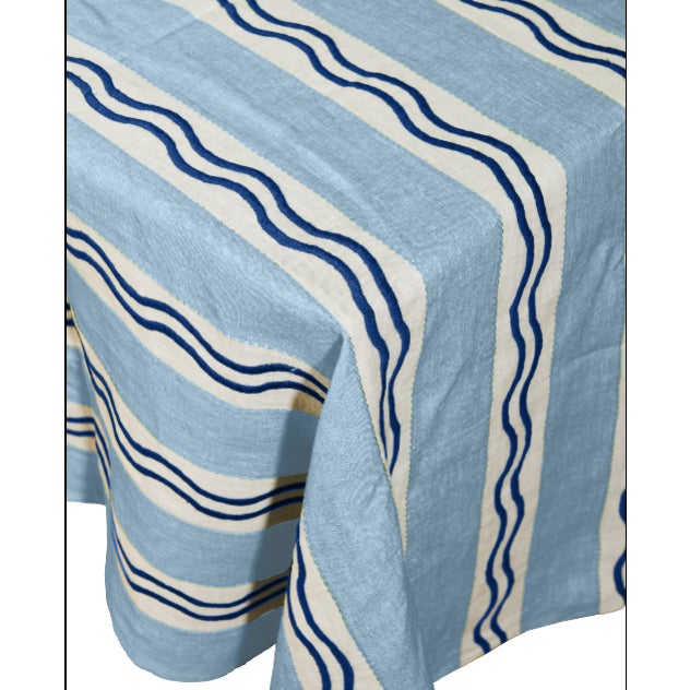 Our Monaco Stripe Tablecloth, hand-embroidered onto 100% linen in a deep, salon-room green — the stripe and squiggle...