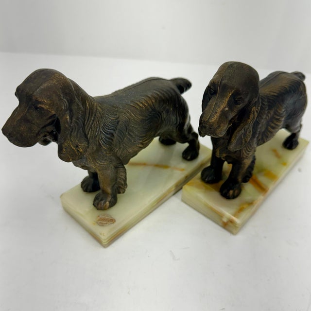 Pair of Mid Century Modern Dog Book Ends on Onyx Bases. Sticker with "Genuine W Diamond Onyx"