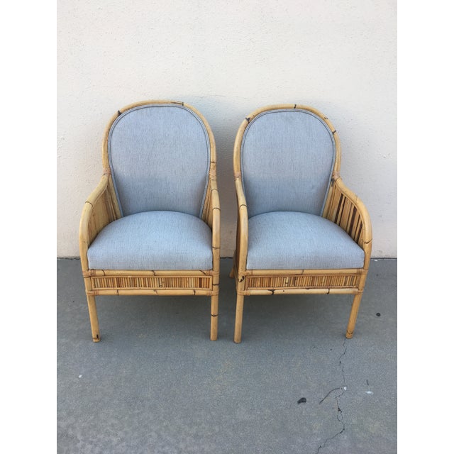 Lovely pair of newly upholstered bamboo and willow Henry Olko arm chairs. These are a beautiful pair of chairs that work...