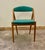 This set of four dining room chairs, model 31, Attributed to the renowned Kai Kristiansen around the 1960s, showcases the...