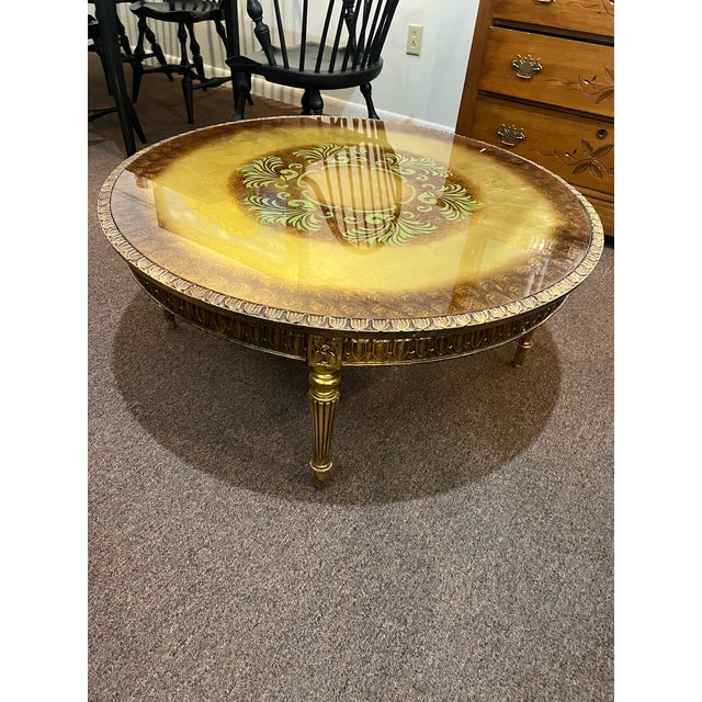 Beautiful Rocco style hollywood regency italian import style coffee table with lots of gleam and character.