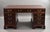 Edwardian pedestal desk, crafted in richly figured mahogany . The rectangular top is inset with a burgundy leather writing...