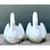 This pair of vintage cast concrete swan planters is a graceful study in garden sculpture, modeled in a soft, chalky white...