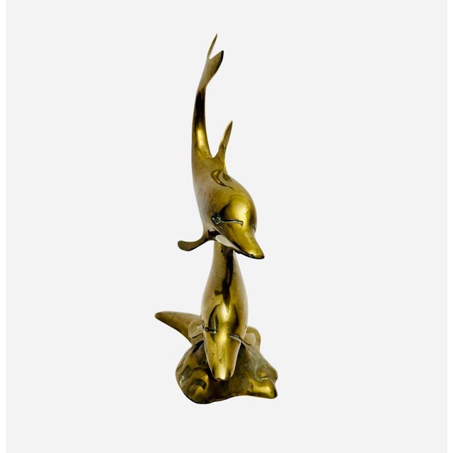 Vintage 11” Brass Dolphin Sculpture MCM Hollywood Regency Nautical Decor. This beautiful vintage brass sculpture is in...