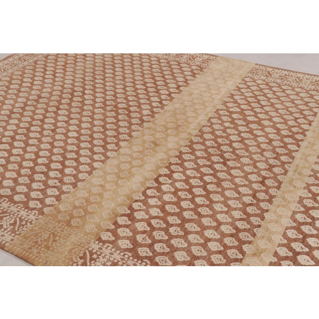 Made with hand-knotted wool and silk, this 8x10 rug design is an exciting new representation of the Block Print Collection...