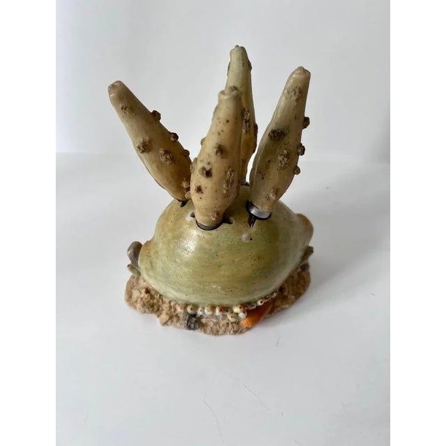 Recently acquired from Paris...A unique set of four cheese spreaders in a holder of a resin shell. The four knives have a...