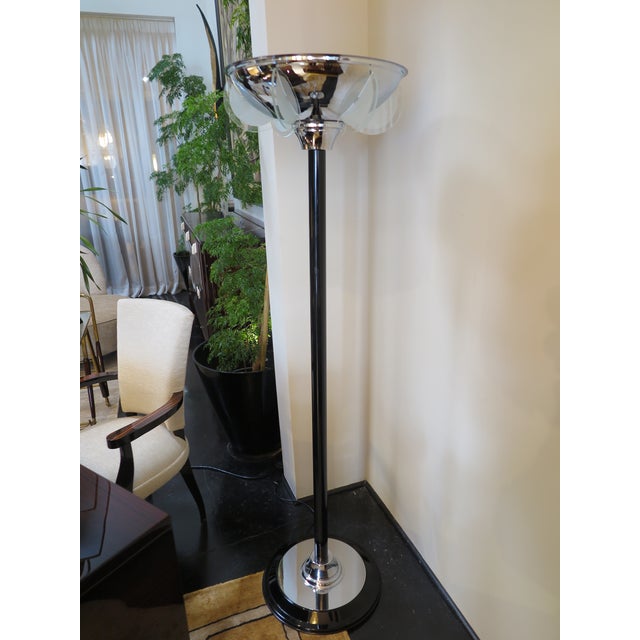 Art Deco Style Floor Lamps in black lacquer with nickel details on base and shade. Half-round frosted glass inserts emit...