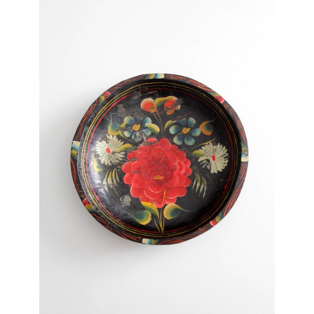 Vintage hand-painted wooden bowl featuring a vibrant floral design set against a black background. Originally sold through...