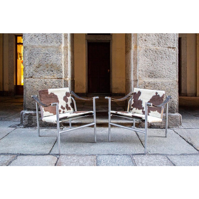 Armchairs with chromed metal frame, fur seat and backrest. Early edition. Model LC1 Designer Le Corbusier Manufacturer...