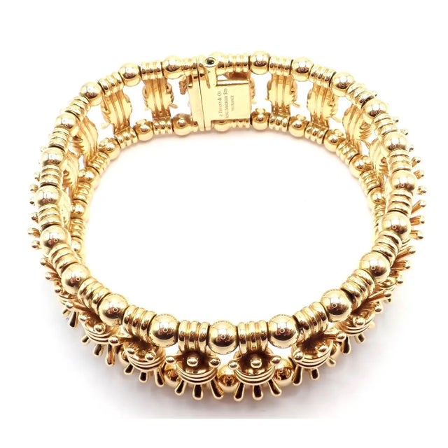 Tiffany & Co. Jean Schlumberger Yellow Gold Bowtie Bracelet Details: Metal: 18k Yellow Gold Length: 7.25" Weight: 100.3...