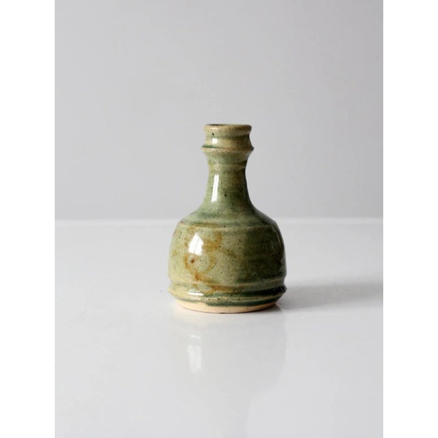 A vintage Dodge Station Pottery vase dated 1984 and signed by the artist, Jeff Napp. Hand-thrown with an elegant...