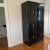 Mirror back interior, glass upper shelves, lockable bottle cabinet below The Tuxedo Tall Cabinet was inspired by a vintage...