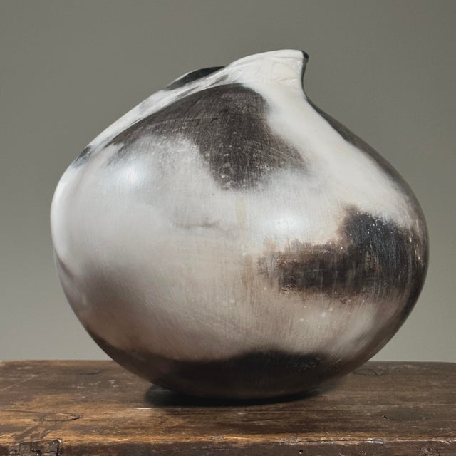 Vintage Raku Fired Burnished Seed Pot with Carved Neck, Signed. Short necked round vase with a folded ridge that leads to...