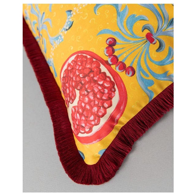 Set against a backdrop of sunny yellow, the pomegranate takes center stage, its vibrant hues bursting forth in a...