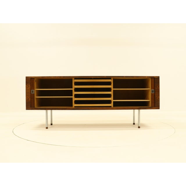 Sideboard model ry 25 in rosewood by hans wegner. manufactured by ry mobler, denamark 1960s. front with 2 tambour doors,...
