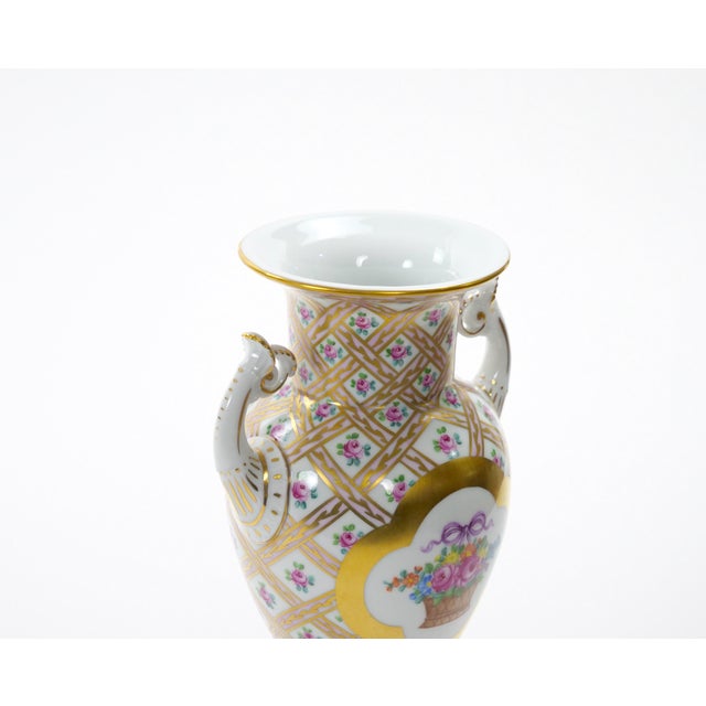 An exquisite German Dresden porcelain decorative vase, crafted in Germany during the early 20th century by one of the...