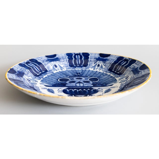 A superb example of an 18th-Century Dutch Delft faience charger with the beloved 'Peacock' pattern by the De Klaauw (The...