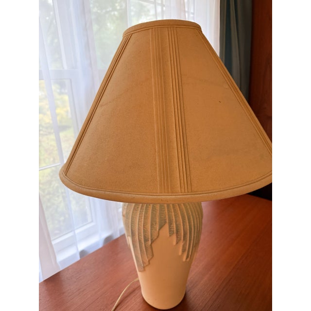 Elevate your space with this authentic, statement-making postmodern table lamp by Elite, dated 1995. Balancing a striking...