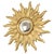 Large vintage sunburst mirror featuring convex glass and layered rays; crafted from gold-colored resin, this is an...