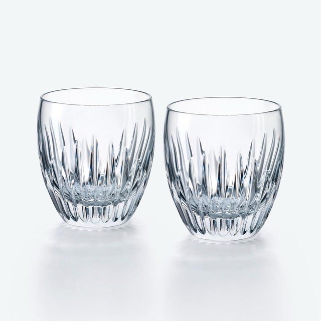 A stunning pair of Baccarat Massena crystal tumblers featuring the house's iconic pattern of deep beveled cuts that...