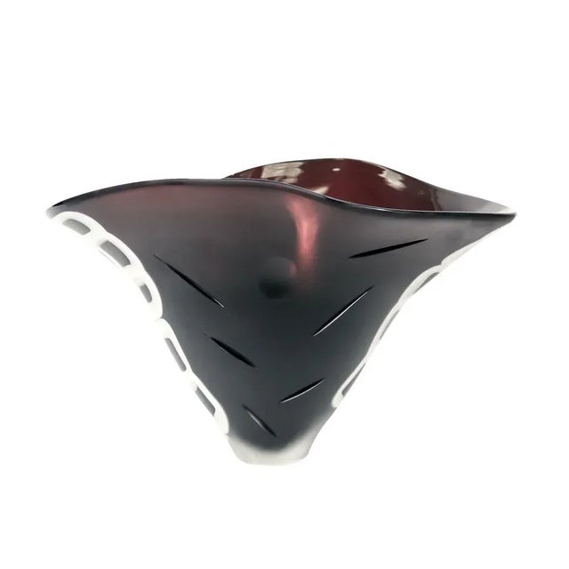 A unique blown glass vase with several techniques involved. Dark mink color with white Murrine. Signed. This piece is...